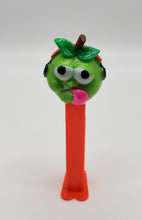 Load image into Gallery viewer, Goofy Green Apple Head Headphones Tongue Pez Dispenser
