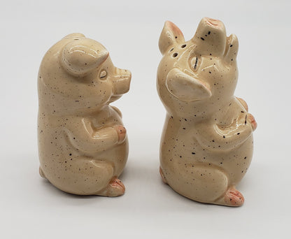 Pigs with closed eyes salt and pepper shakers